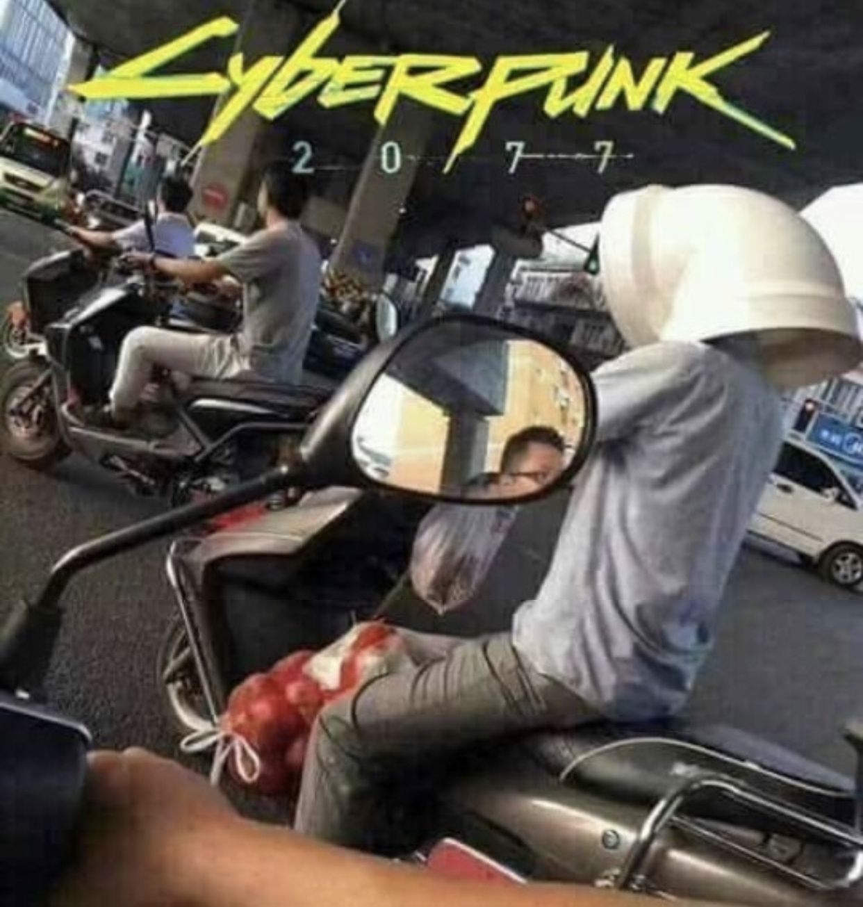 The meme is an image of a person wearing a helmet with a faceless, blank expression, riding a motorcycle. The text "Cyberpunk 2077" appears above the image, referencing the popular video game. The humor comes from the juxtaposition of the futuristic, high-tech game's title with a mundane, everyday scene of a person riding a motorcycle in a crowded city.